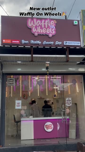 Waffle on Wheels new outlet with magenta signboard