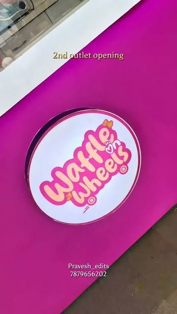 Glowing Waffle on Wheels logo sign at the second outlet